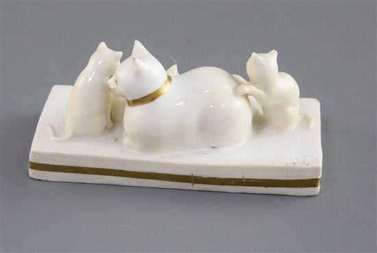 A Rockingham porcelain group of a cat and three kittens, c.1826-30, L. 11cm